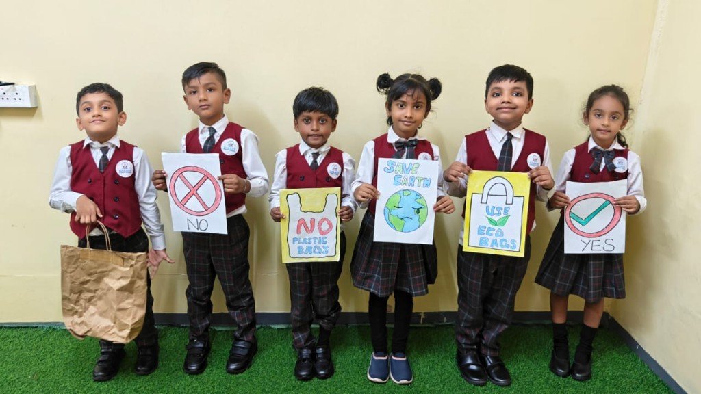 Galaxy Infant School students holding Save Earth and eco bag awareness posters