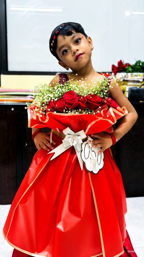 Child in flower bouquet fancy-dress costume