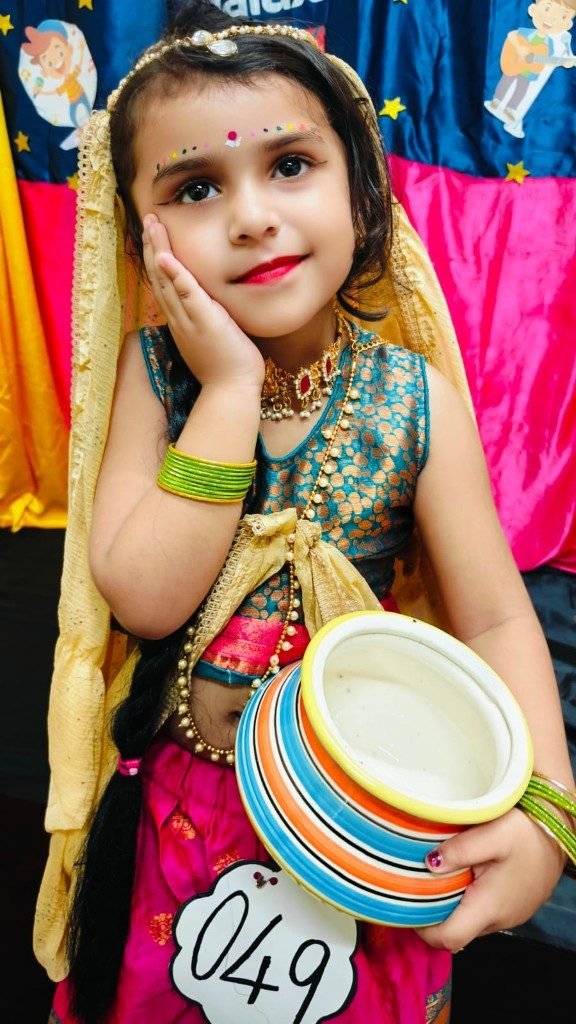 Pre-KG child in traditional costume for Janmashtami celebration at Galaxy Infant School