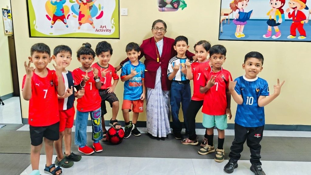 UKG Tiny Leaders with teacher on sports jersey day at Galaxy Infant School